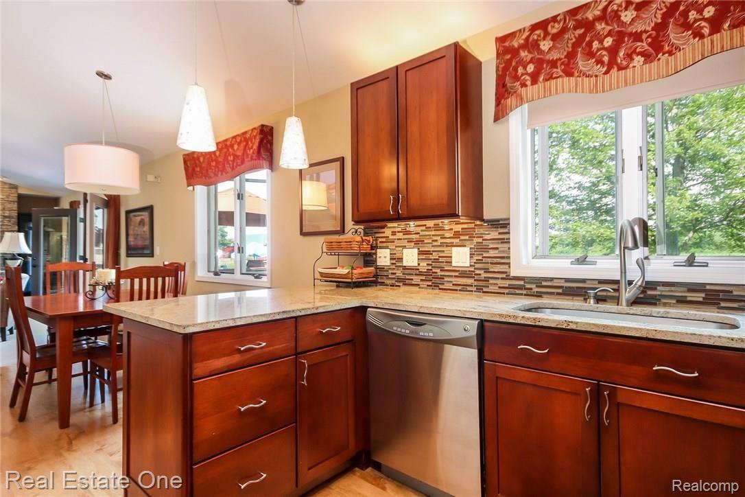 3550 Johnson Road Saline, MI 48176 - Photo 16 of 82 GRANITE COUNTERS AND TILE BACKSPLASH