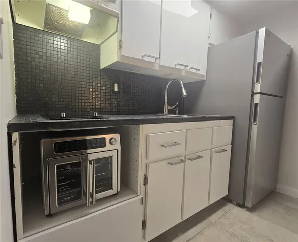 a view of workspace with wooden floor windows