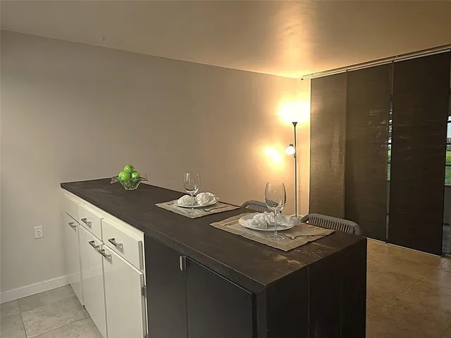 a living room with furniture a couch and a potted plant