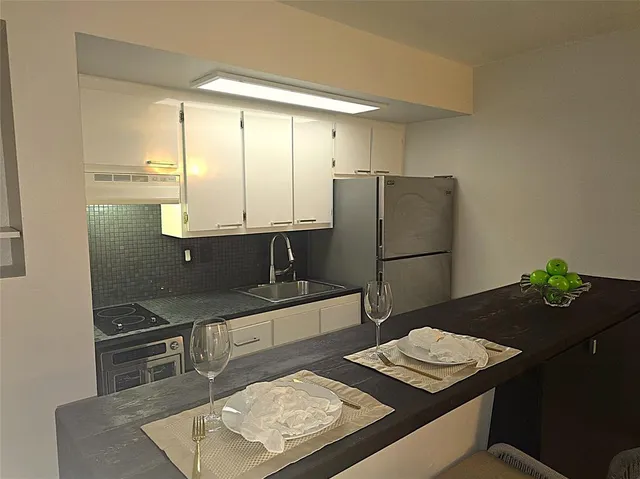 a view of a house with a backyard patio and swimming pool