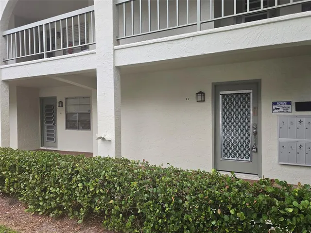a view of a tennis ground with a city view