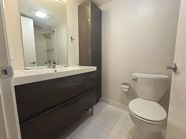 a living room with furniture a rug and a wall painting