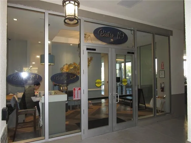 a view of a chairs and table under an umbrella in patio