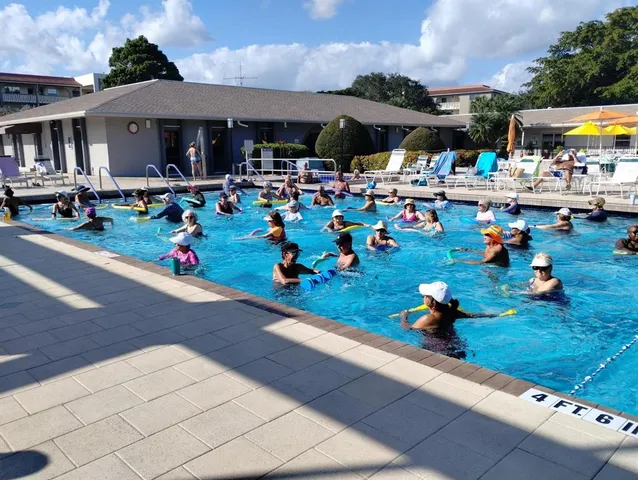 a group of people sitting in front of retail shop