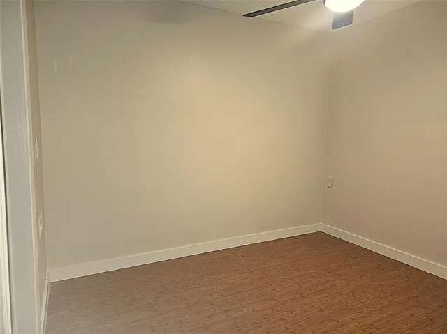 a bathroom with a granite countertop sink a mirror and a shower