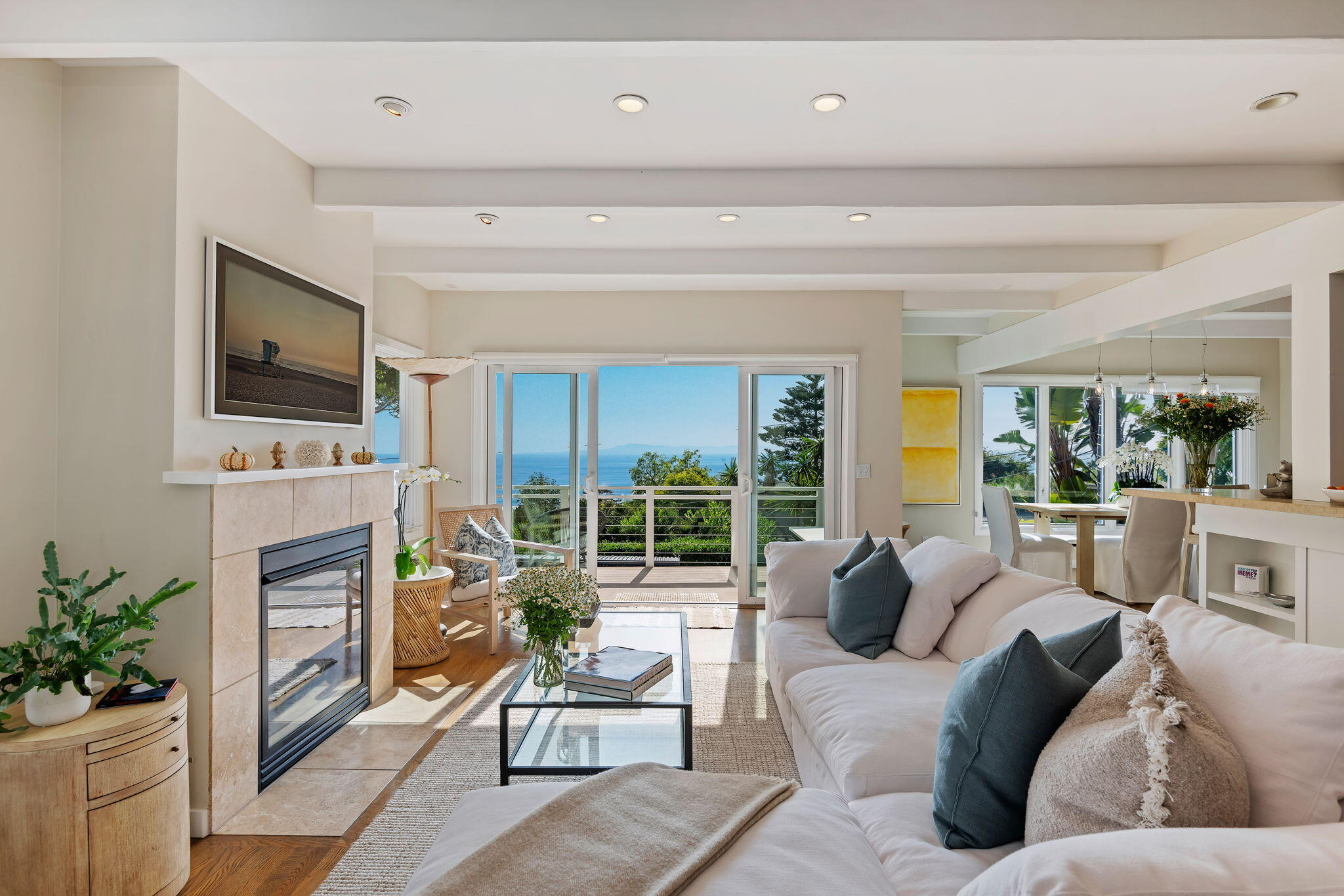 a living room with fireplace furniture and a flat screen tv