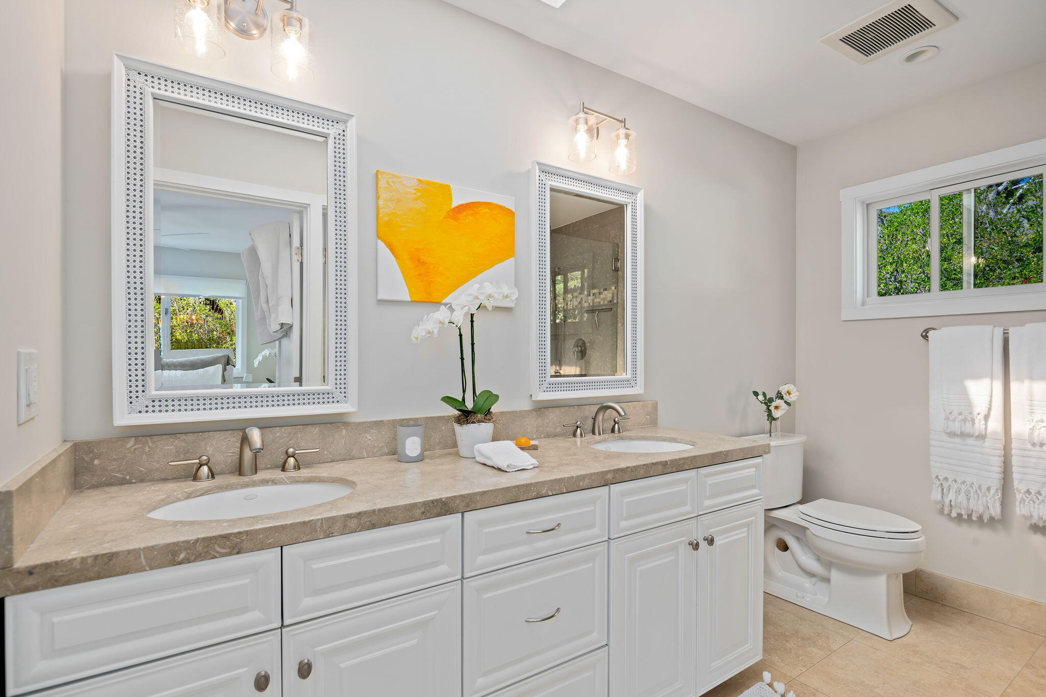 2290 Whitney Avenue Summerland, CA 93067 - Photo 13 of 28 a bathroom with a granite countertop sink mirror vanity and a toilet
