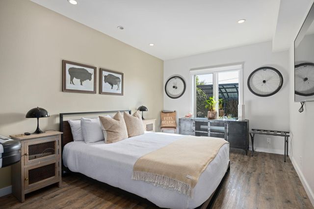 a view of a livingroom with furniture and a potted plant
