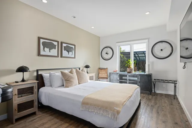 a view of a livingroom with furniture and a potted plant