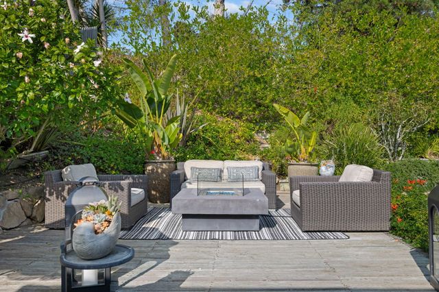 a view of a backyard with table and chairs