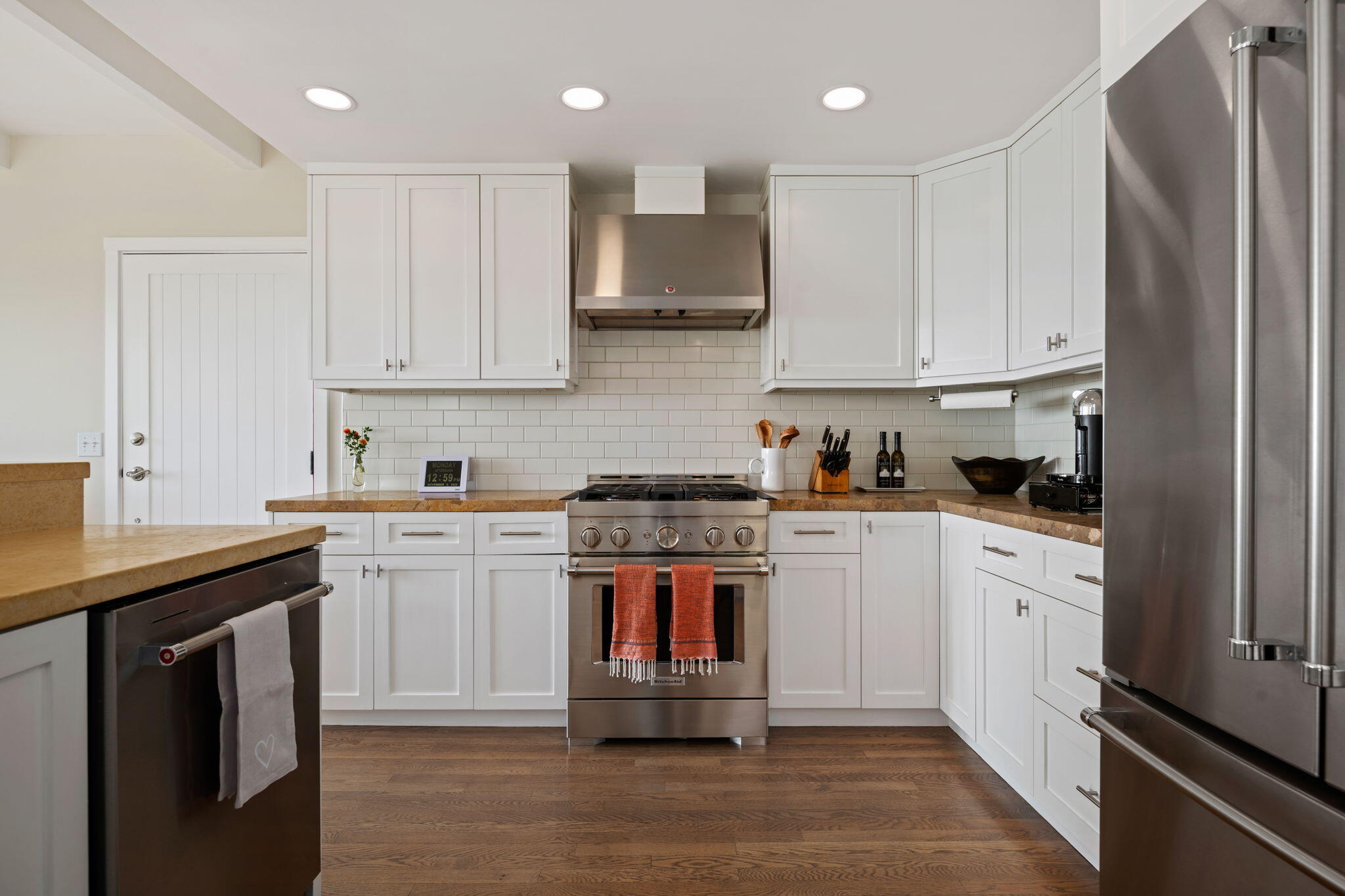 2290 Whitney Avenue Summerland, CA 93067 - Photo 8 of 28 a kitchen with stainless steel appliances granite countertop a stove and white cabinets