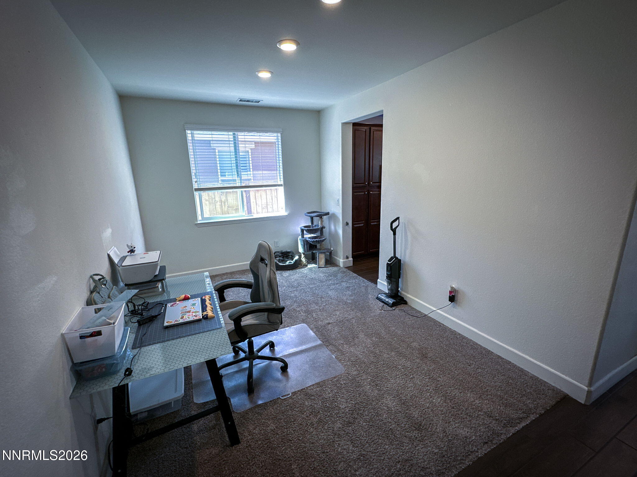 7330 Overture Drive Reno, NV 89506 - Photo 6 of 17 a workspace with furniture and a window
