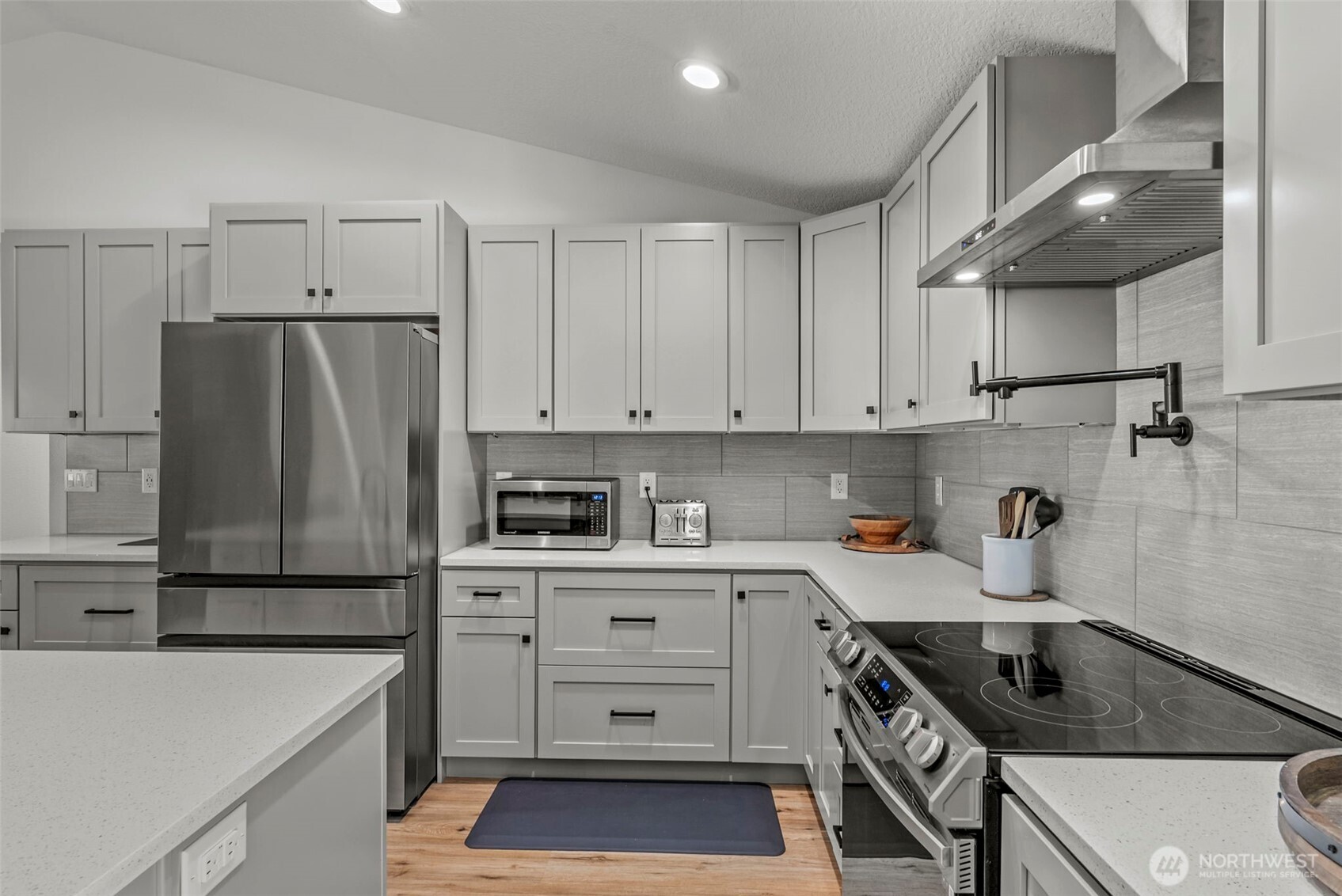3167 Pacific Way Longview, WA 98632 - Photo 13 of 39 a kitchen with a sink a refrigerator and cabinets