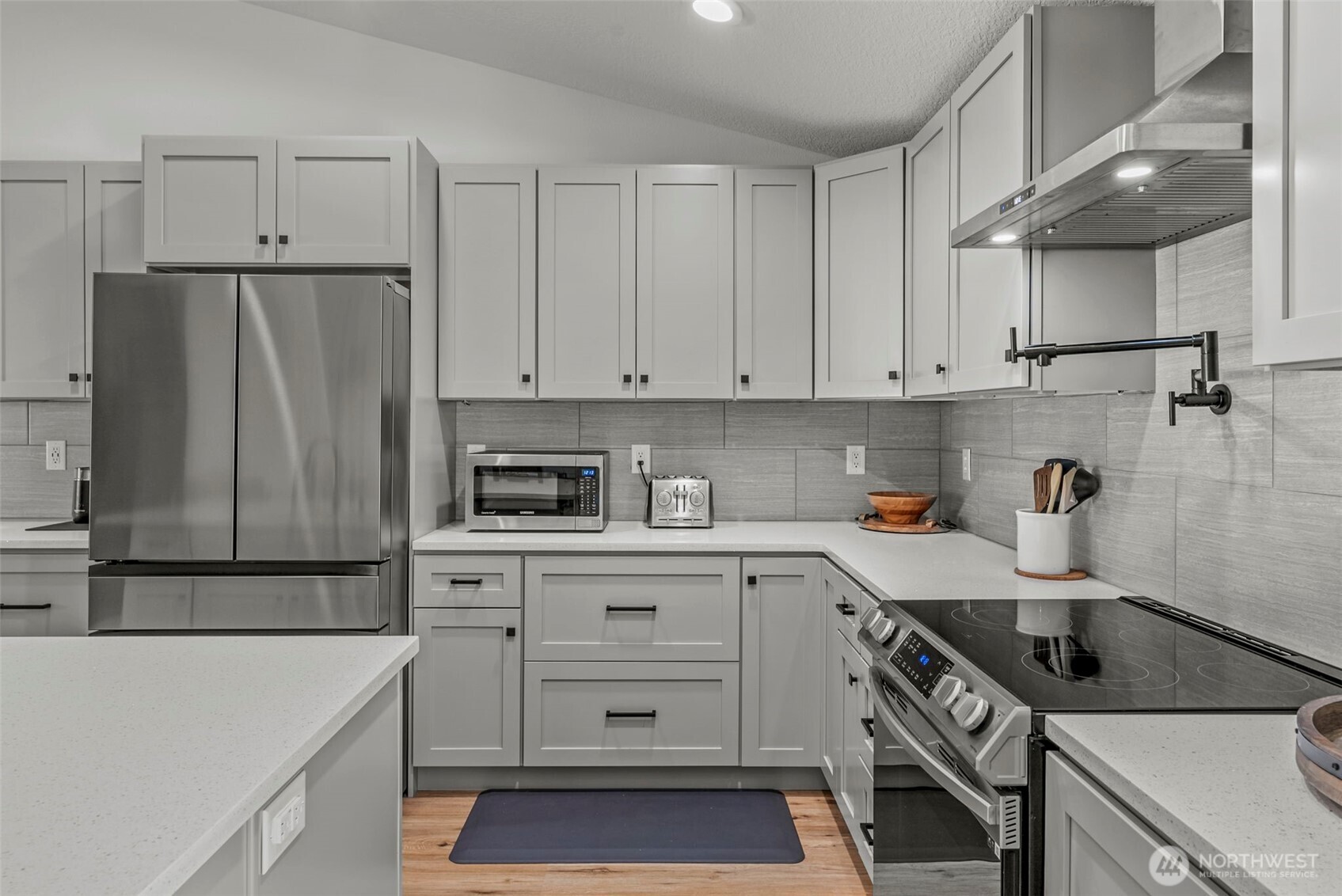 3167 Pacific Way Longview, WA 98632 - Photo 14 of 39 a kitchen with a sink a stove and refrigerator