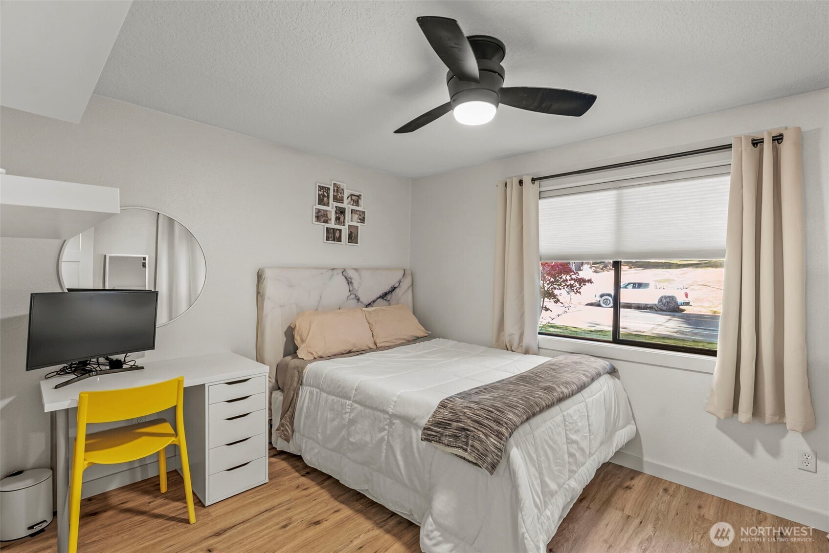3167 Pacific Way Longview, WA 98632 - Photo 17 of 39 a bedroom with a bed television on desk and a window