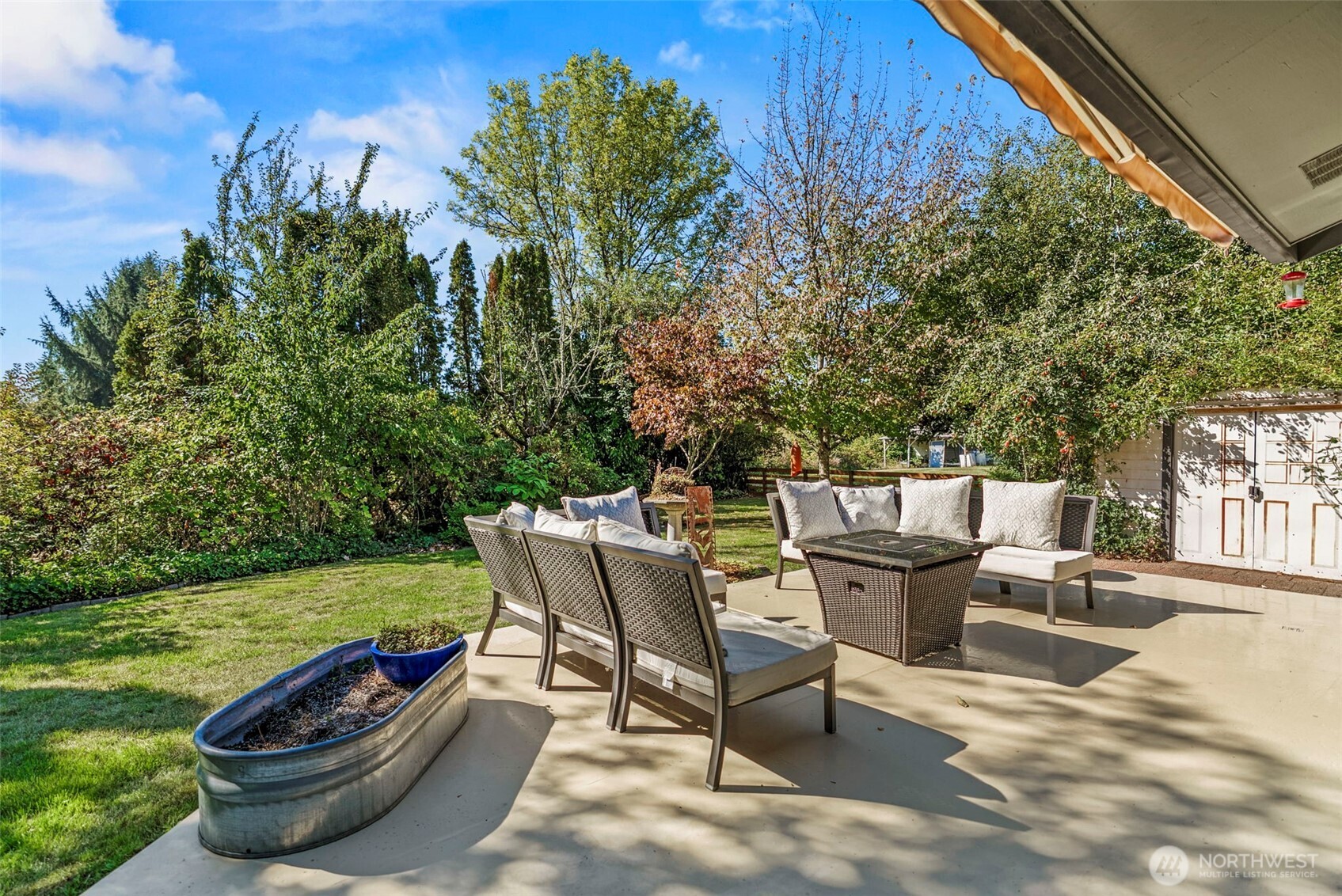3167 Pacific Way Longview, WA 98632 - Photo 28 of 39 a view of a lounge chair and fire pit in the backyard