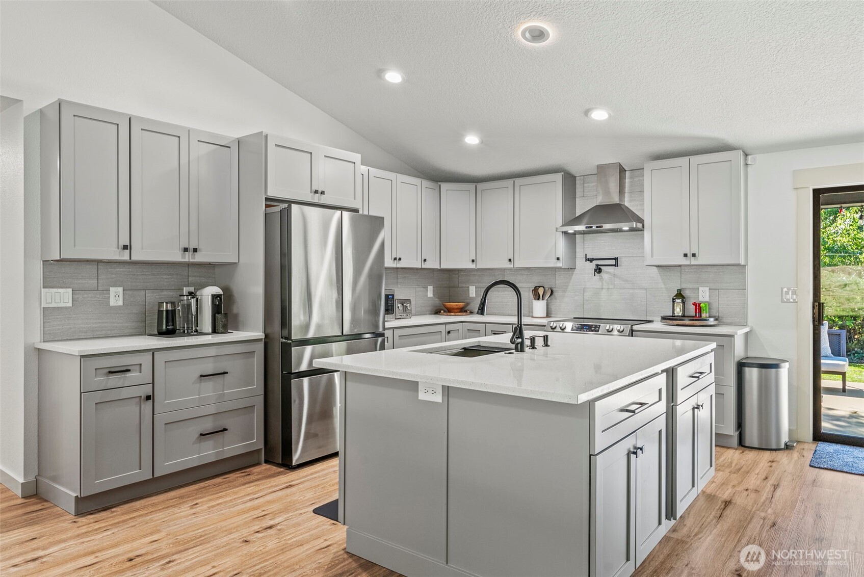 3167 Pacific Way Longview, WA 98632 - Photo 7 of 39 a kitchen with white cabinets stainless steel appliances and a sink