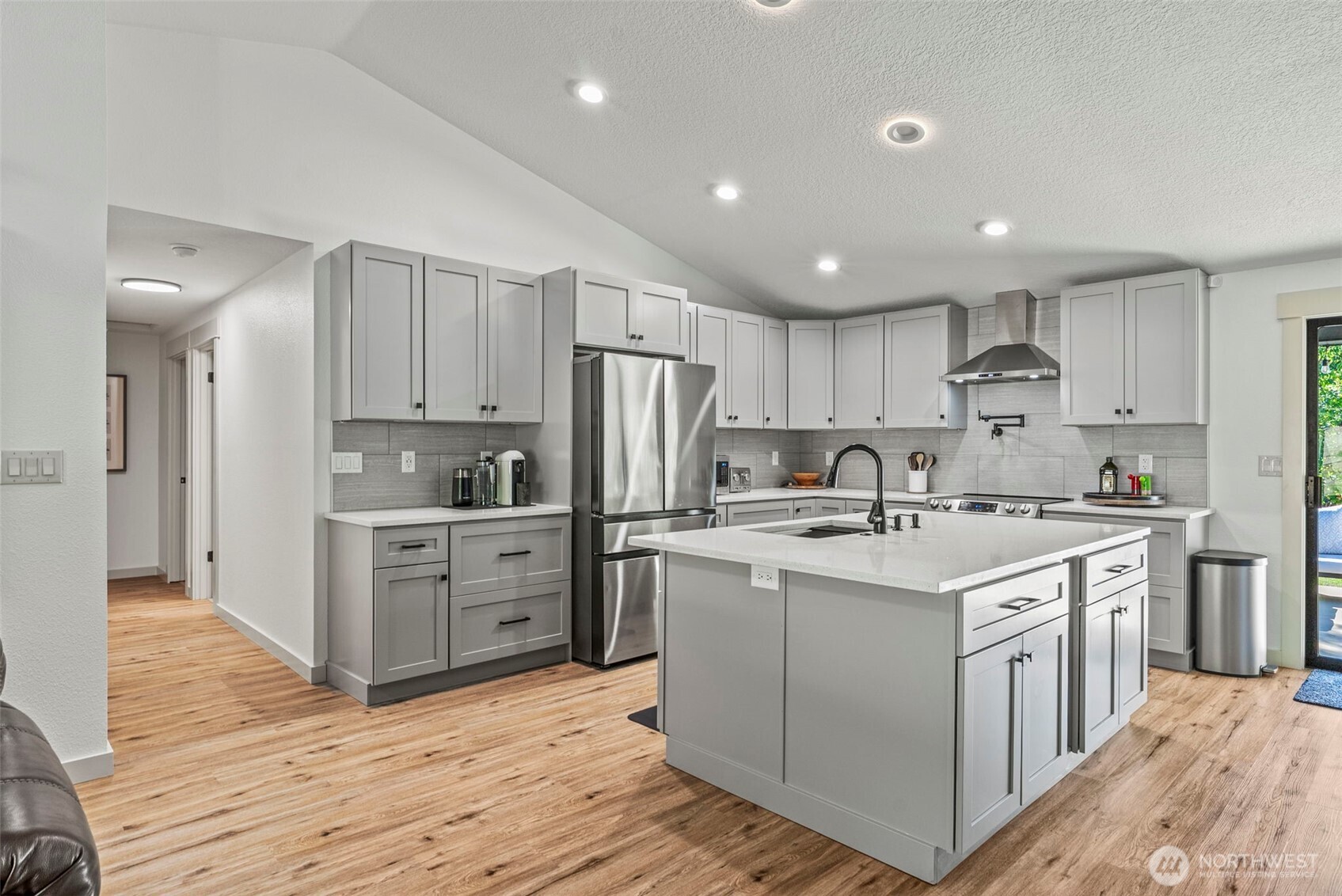 3167 Pacific Way Longview, WA 98632 - Photo 8 of 39 a kitchen with white cabinets stainless steel appliances and sink