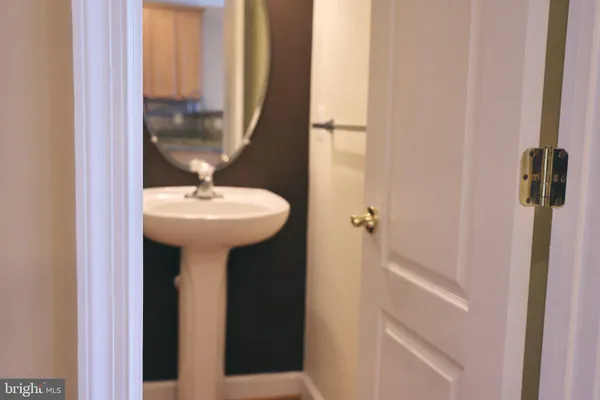 a bathroom with a sink and mirror