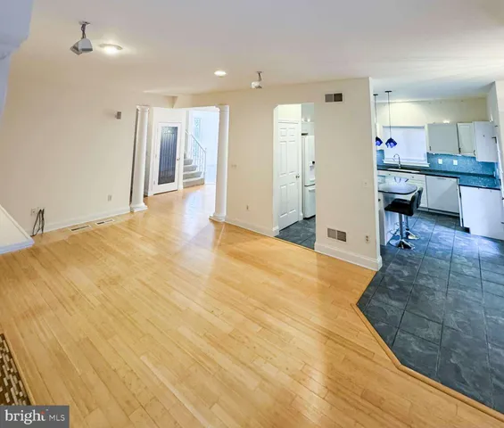 a view of a livingroom with a kitchen