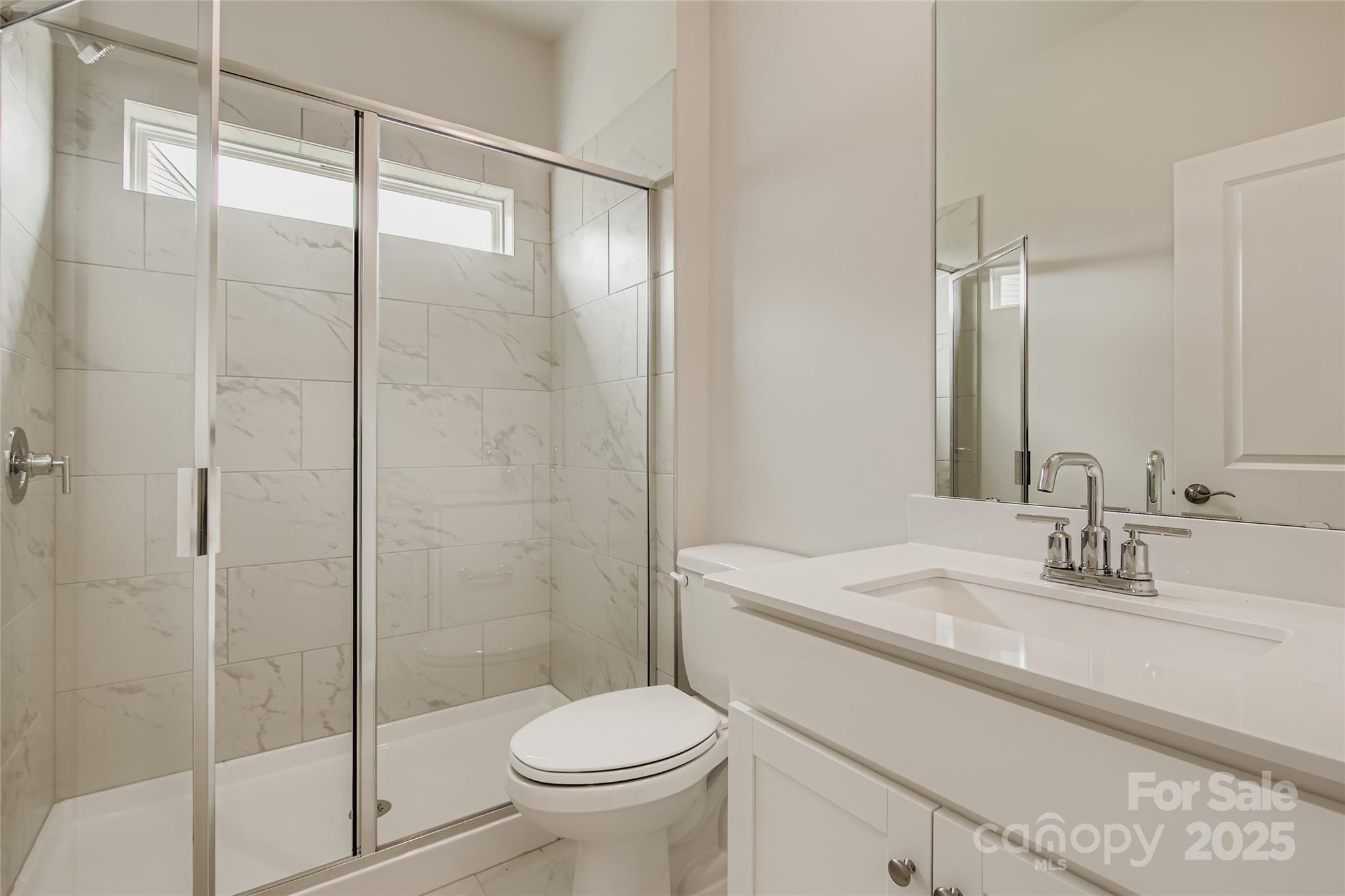 2803 Morning Song Way Lancaster, SC 29720 - Photo 11 of 18 a bathroom with a sink toilet and shower