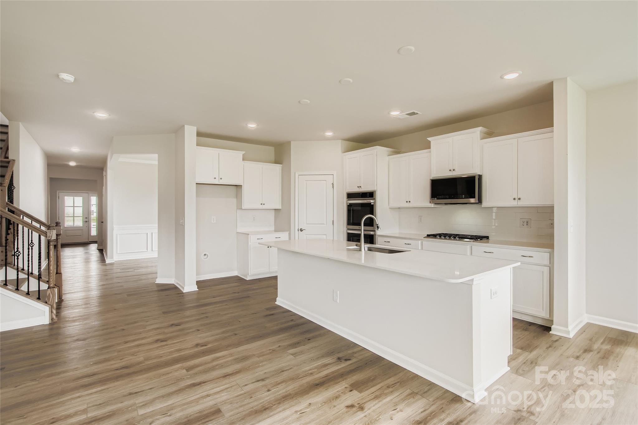2803 Morning Song Way Lancaster, SC 29720 - Photo 6 of 18 a kitchen with stainless steel appliances a refrigerator sink and microwave