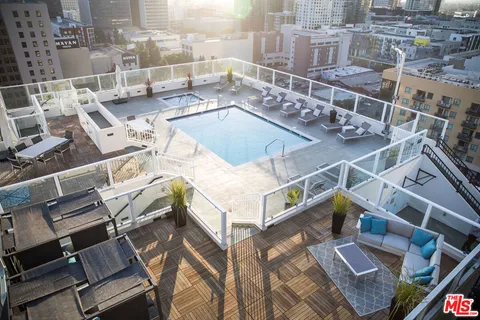 a view of a patio with table and chairs