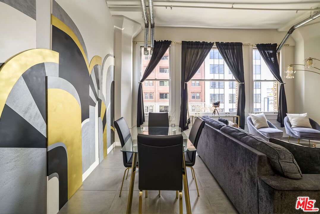 939 South Broadway, Unit 304 Los Angeles, CA 90015 - Photo 14 of 21 a living room with furniture and a large window