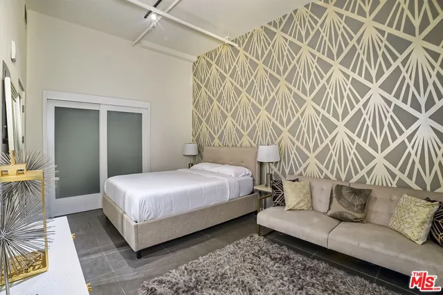 a bathroom with a double vanity sink toilet mirror and shower