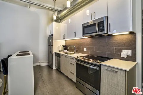 a kitchen with a stove and a microwave