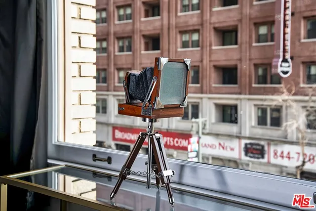 a living room with couches chair and a large window