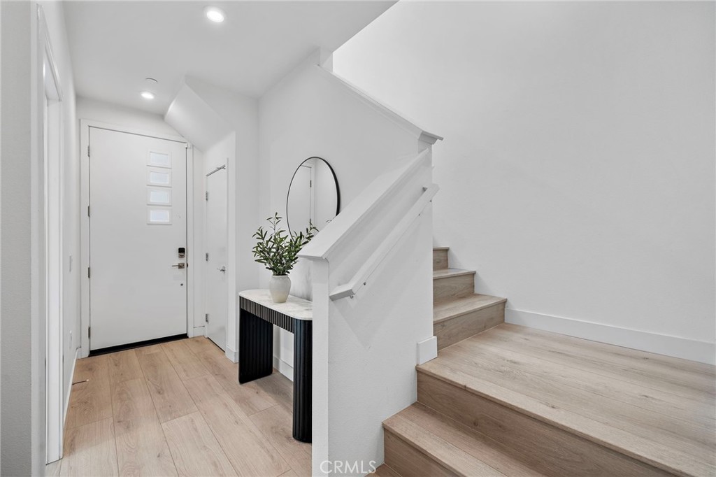 1826 West Bushell Street Anaheim, CA 92805 - Photo 6 of 30 a view of entryway and hall with wooden floor