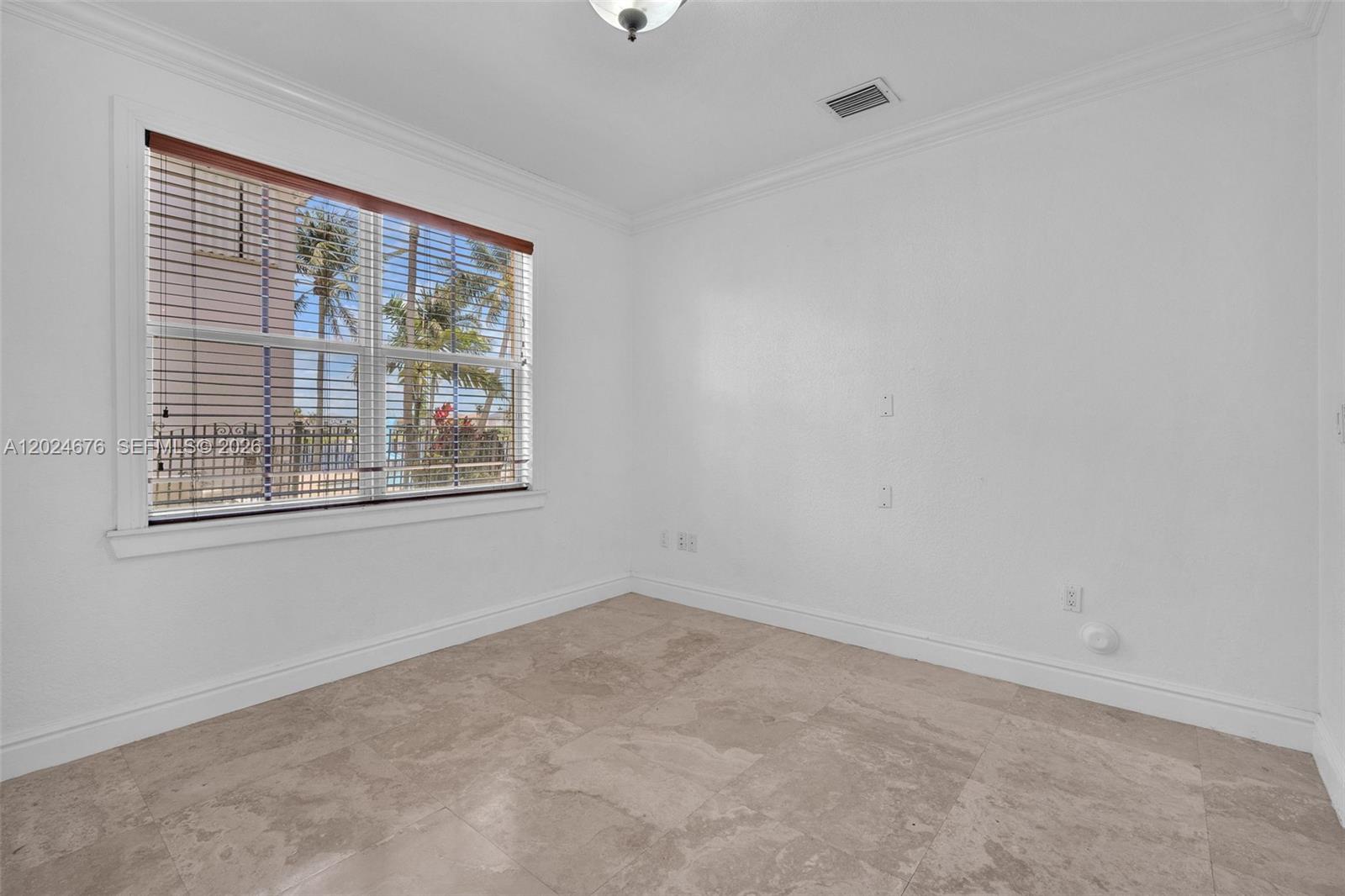 2155 Southwest 156th Court Miami, FL 33185 - Photo 18 of 57 a view of an empty room with a window