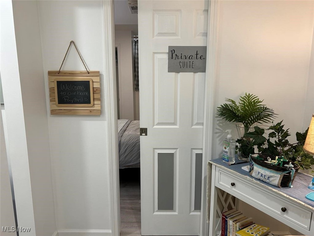 180 Elizabeth Parkway Akron, OH 44304 - Photo 11 of 46 Wonderfully decorated (2023) lower level entry to bedroom with pocket doors.