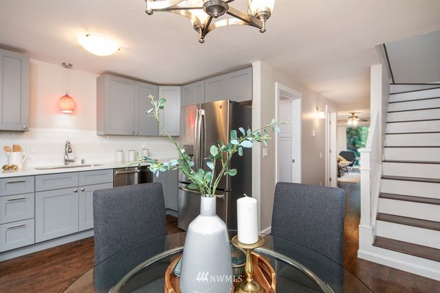 a dining room with furniture and wooden floor