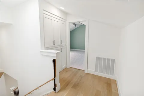 a view of front door with wooden floor