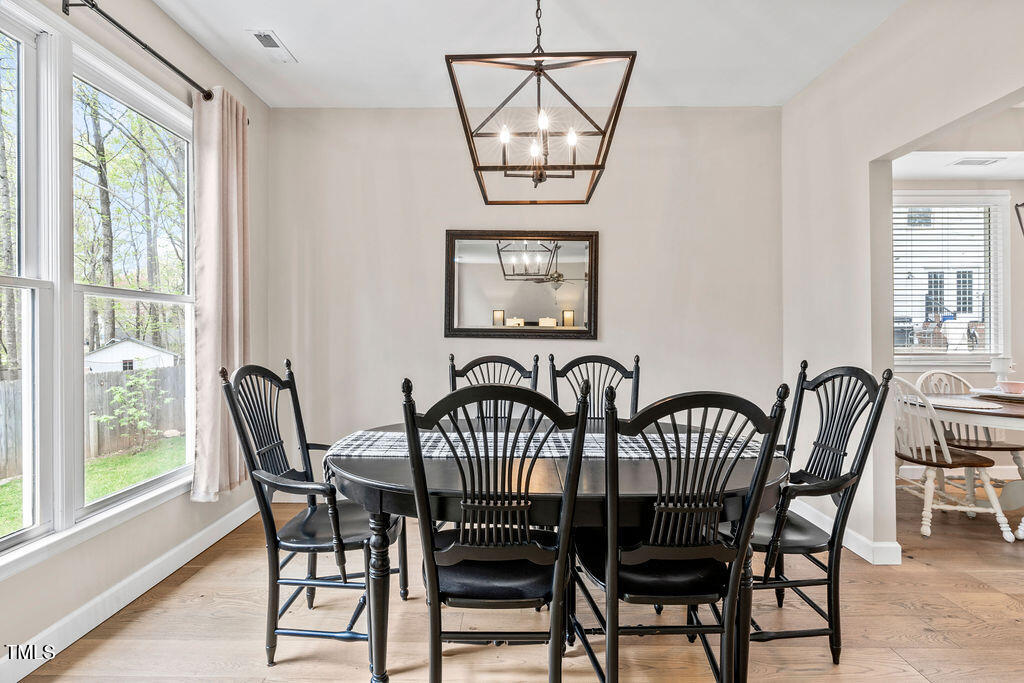 112 Oxpens Road Cary, NC 27513 - Photo 11 of 37 a view of a dining room with furniture window and outside view