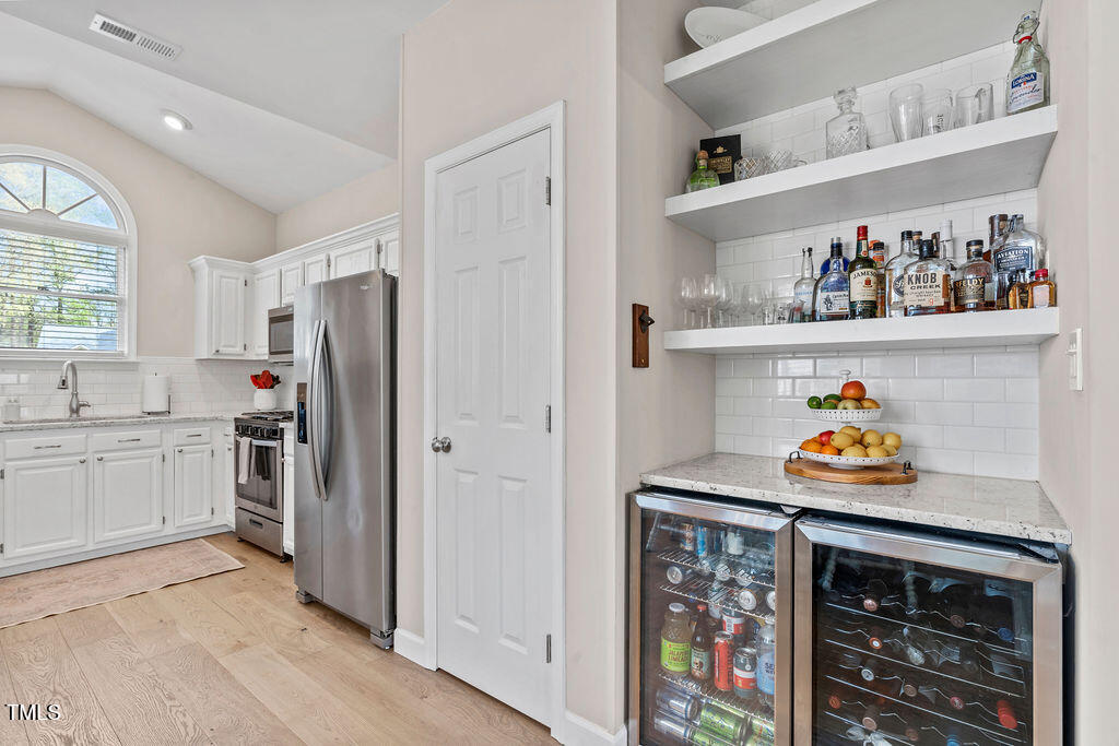 112 Oxpens Road Cary, NC 27513 - Photo 15 of 37 a kitchen with stainless steel appliances granite countertop a refrigerator and a sink