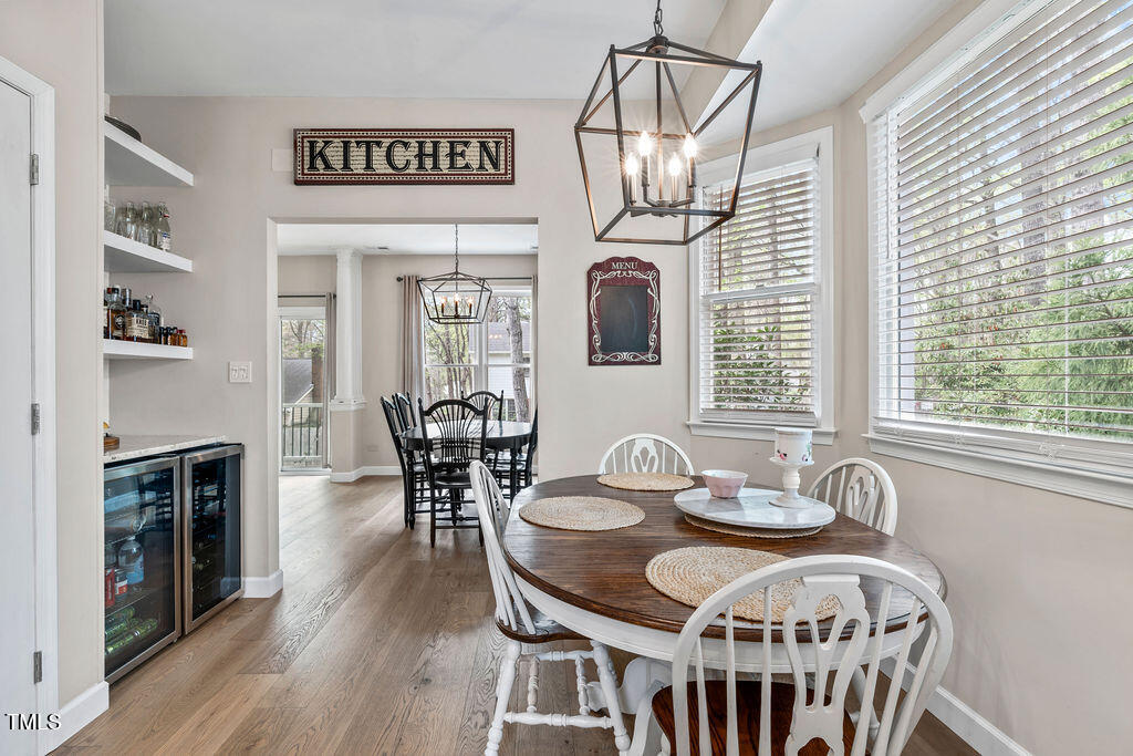 112 Oxpens Road Cary, NC 27513 - Photo 16 of 37 a view of a dining room with furniture wooden floor and chandelier
