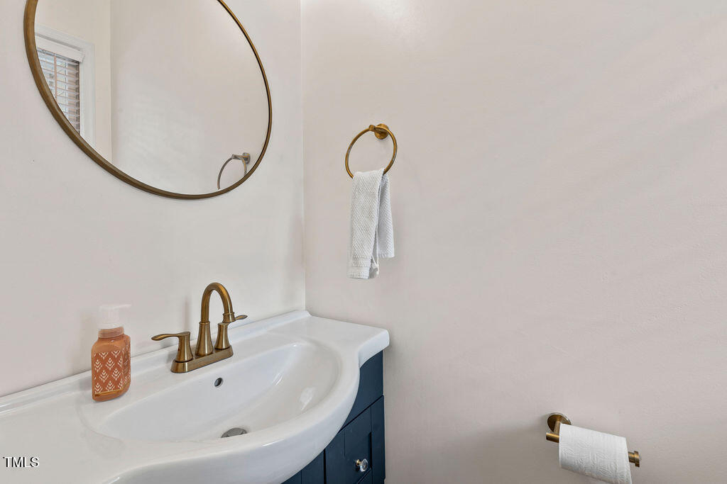 112 Oxpens Road Cary, NC 27513 - Photo 19 of 37 a bathroom with a sink and a mirror