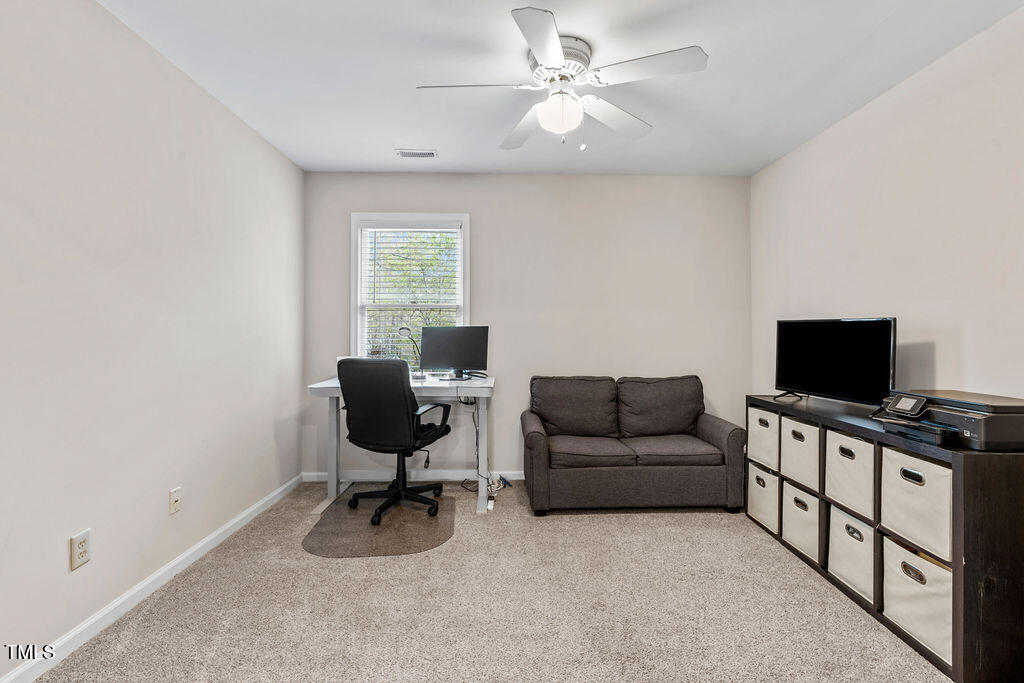 112 Oxpens Road Cary, NC 27513 - Photo 22 of 37 a living room with furniture and a flat screen tv