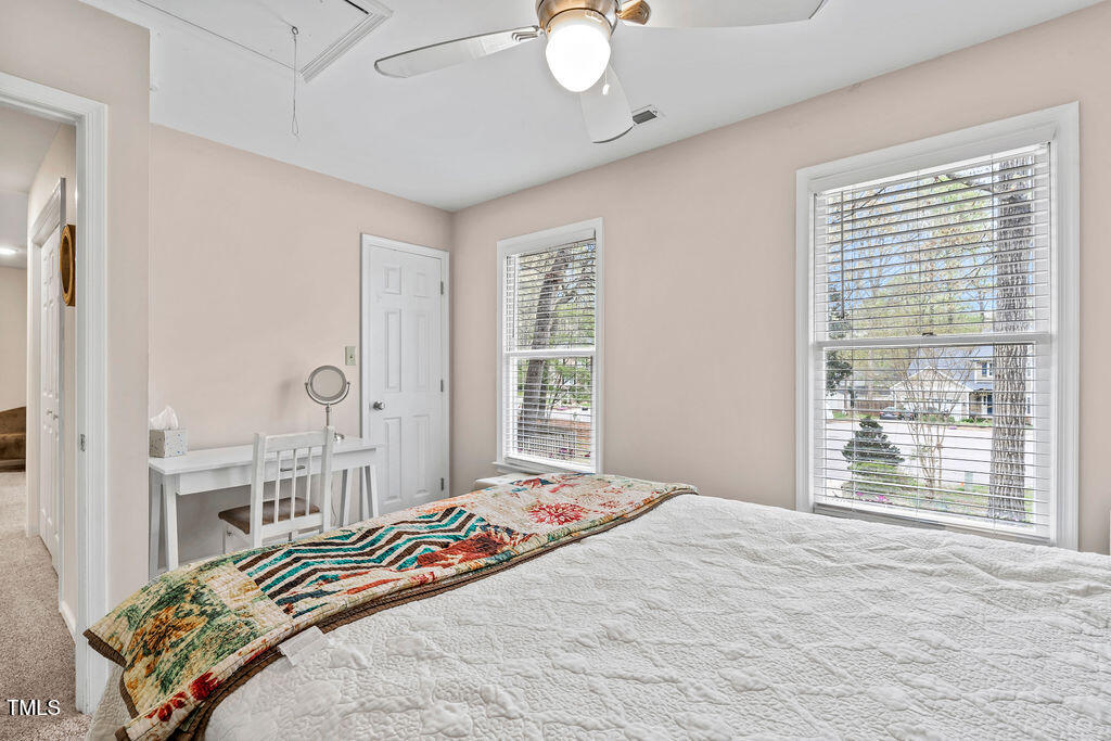 112 Oxpens Road Cary, NC 27513 - Photo 29 of 37 a bedroom with a bed and a large window