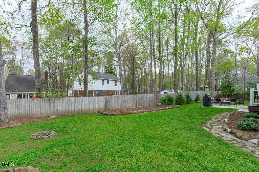 112 Oxpens Road Cary, NC 27513 - Photo 31 of 37 a view of a yard with a fence and trees