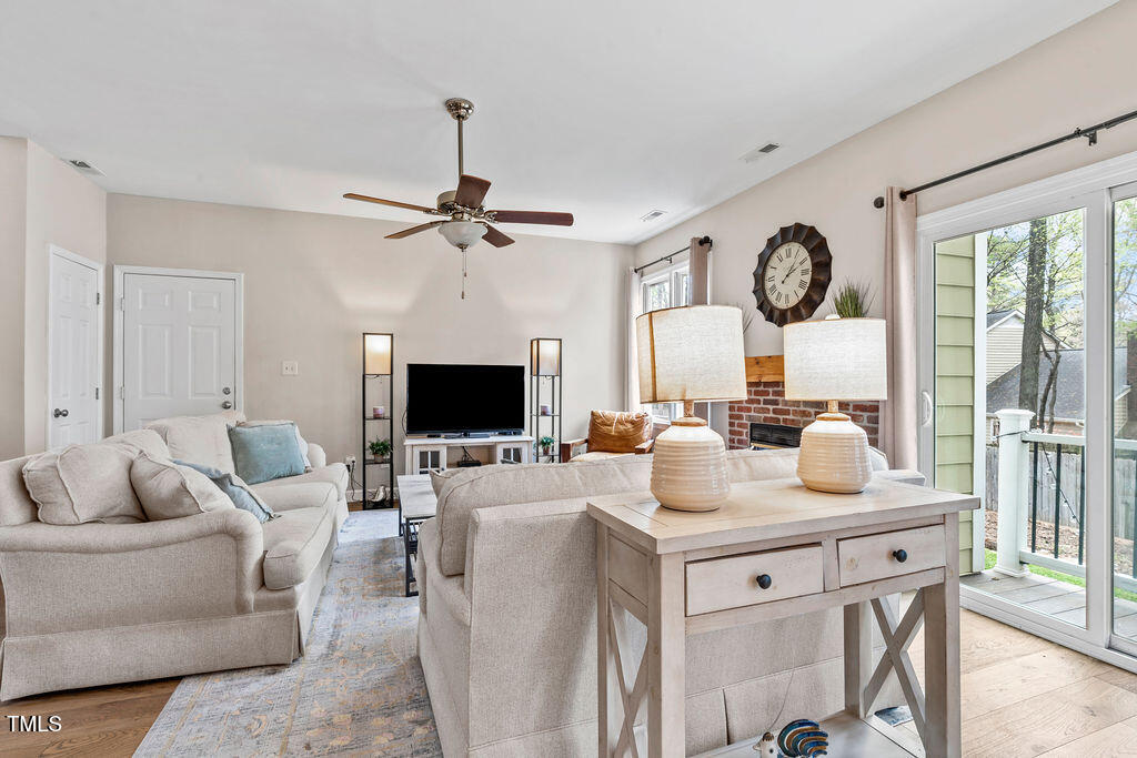 112 Oxpens Road Cary, NC 27513 - Photo 10 of 37 a living room with furniture and a flat screen tv