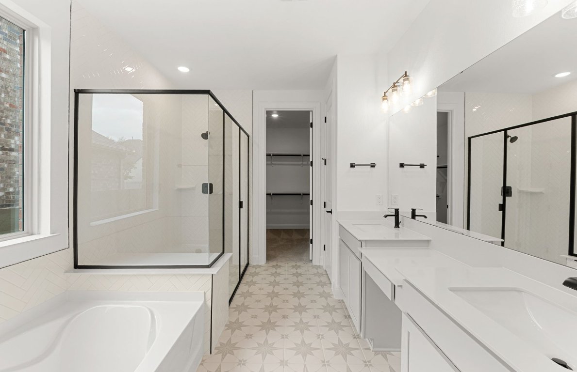 829 Round Mountain Pass Georgetown, TX 78628 - Photo 13 of 17 a bathroom with a double vanity sink mirror and shower