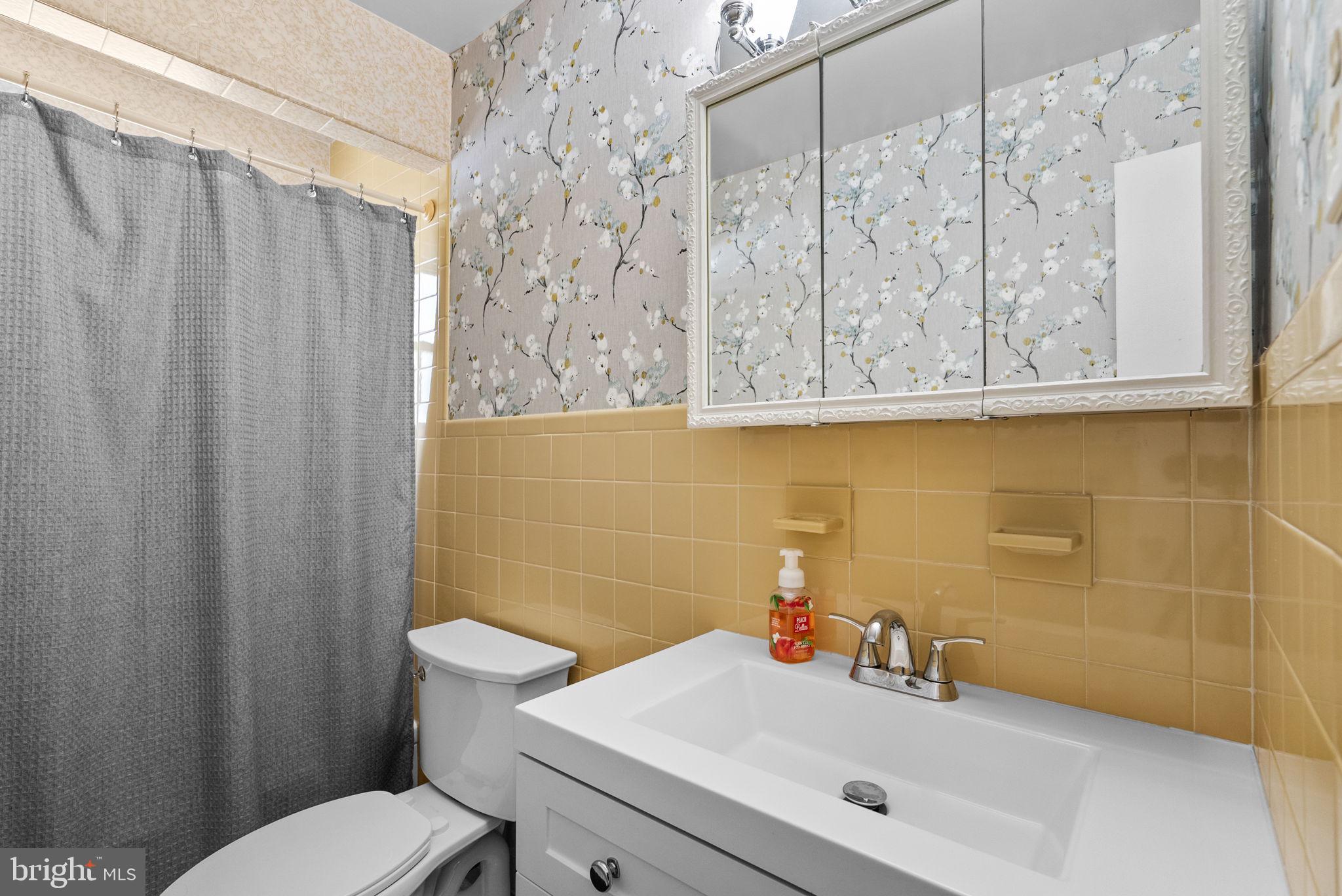 8700 50th Place College Park, MD 20740 - Photo 21 of 33 a bathroom with a sink and a toilet