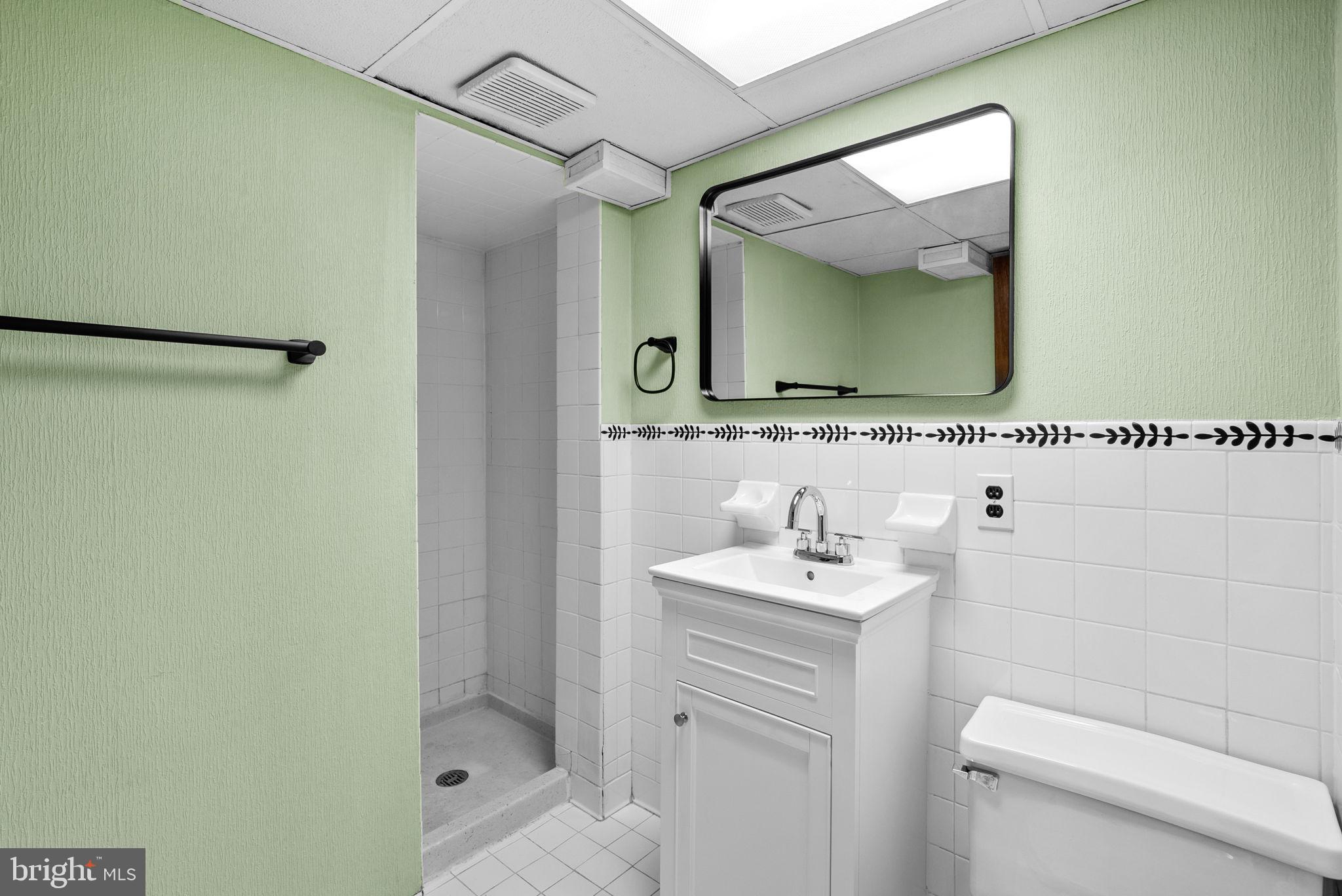 8700 50th Place College Park, MD 20740 - Photo 28 of 33 a bathroom with a sink vanity and mirror