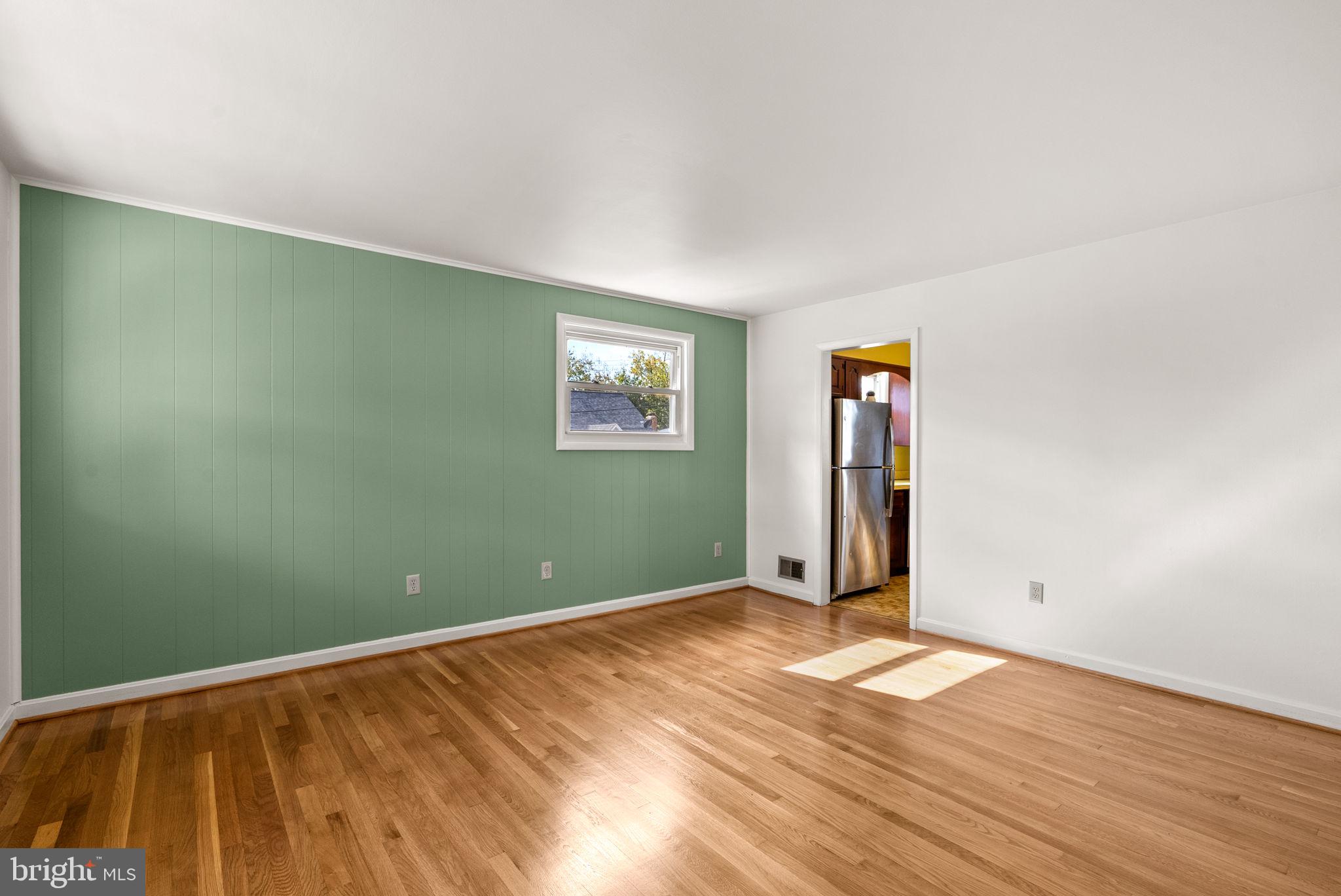 8700 50th Place College Park, MD 20740 - Photo 7 of 33 a view of empty room with wooden floor