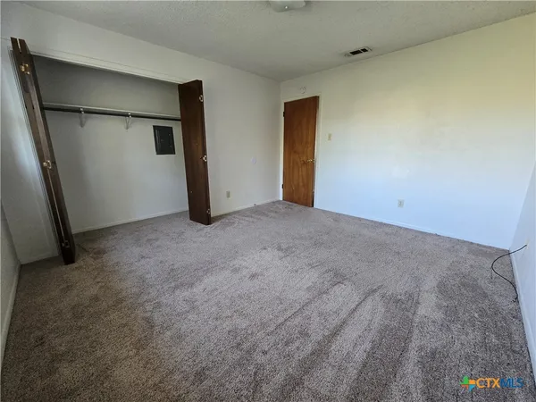 a view of a room with a window