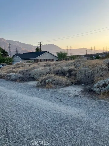 a view of multiple houses with a street